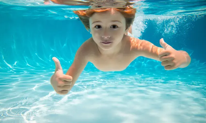 Kid enjoying a clean pool after our cleaning service in Rockville, MD